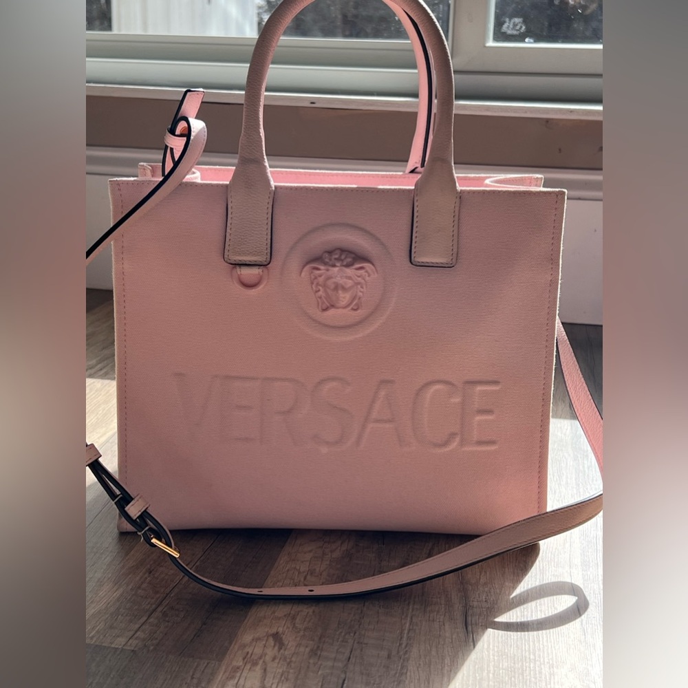 Versace pink handbag. Lightly used. Excellent condition